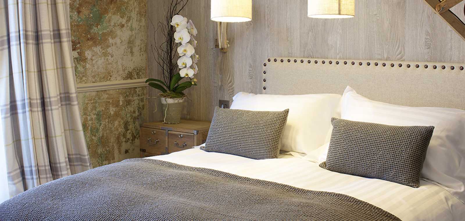 King-size bed with decorative pillows