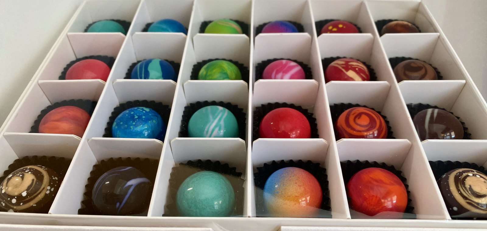 box of 24 artisanal beautiful colourful shiny chocolates