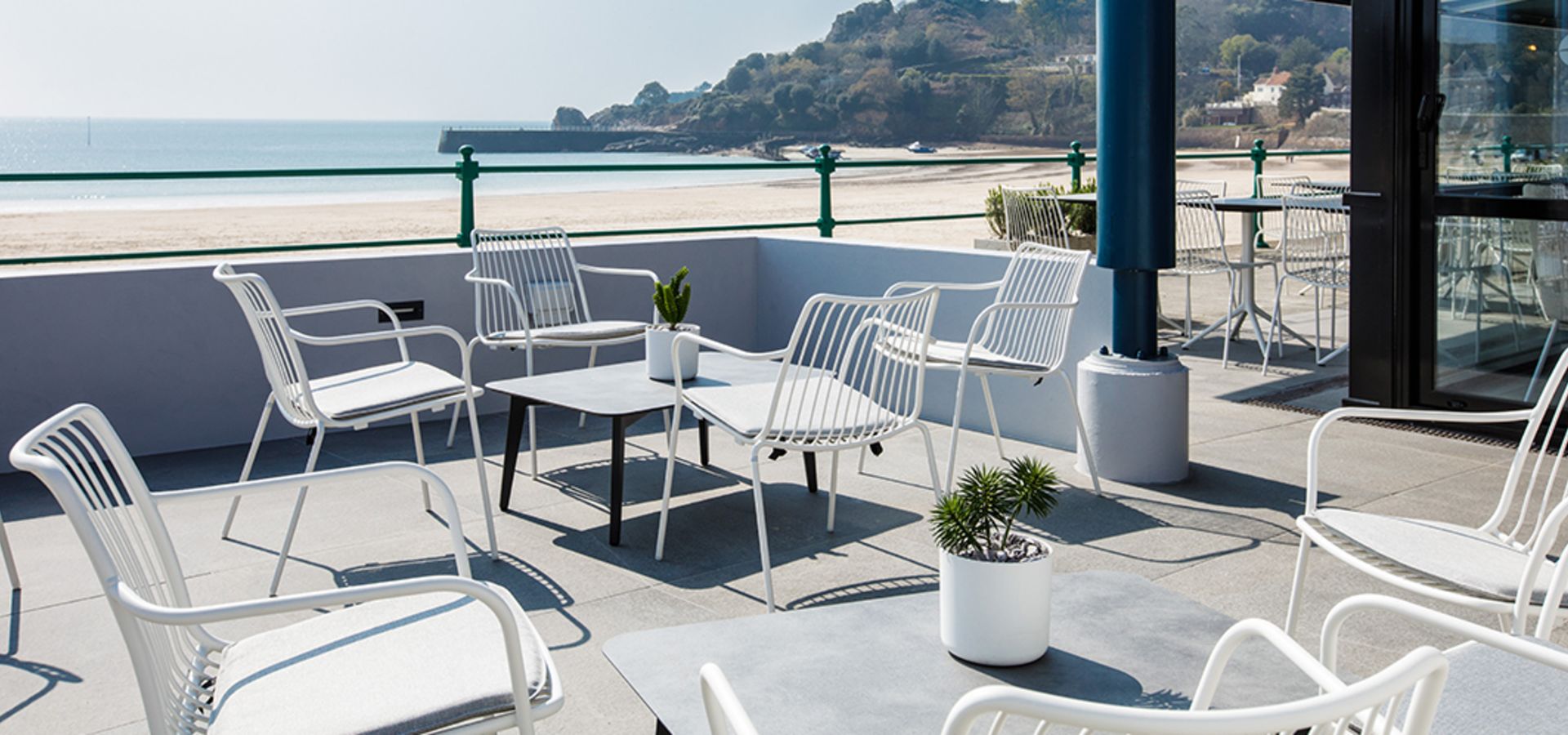 Chairs and tables overlooking the beach