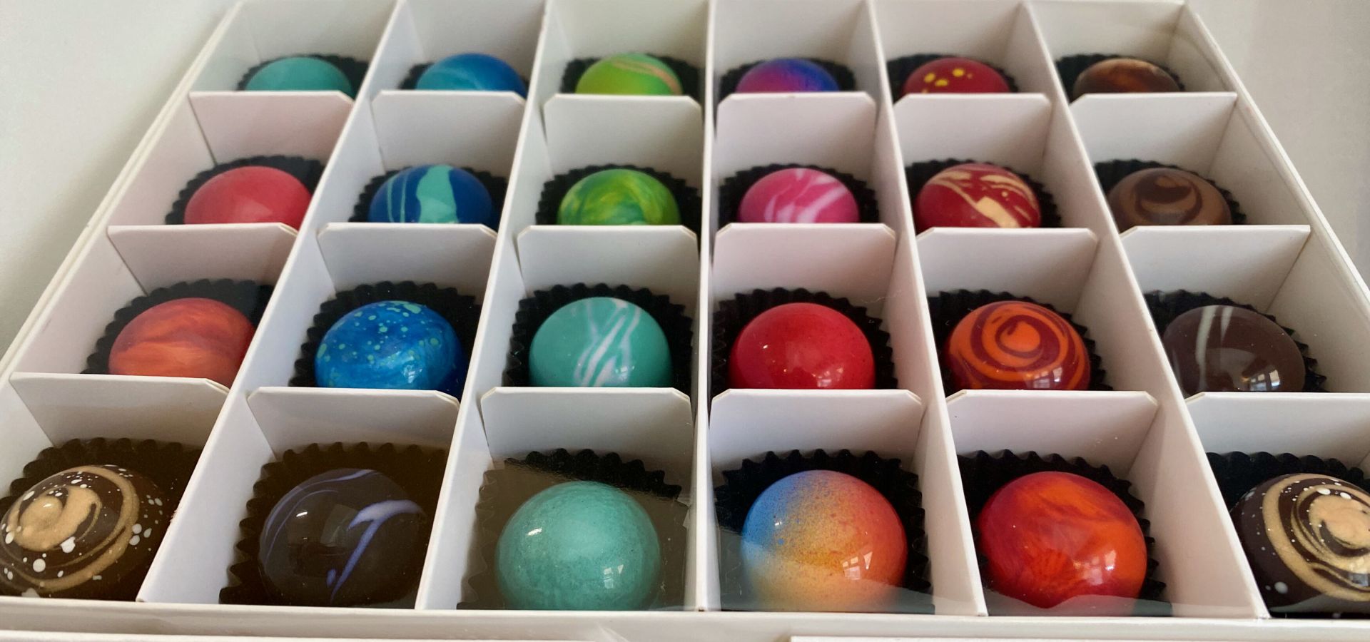 box of 24 artisanal beautiful colourful shiny chocolates