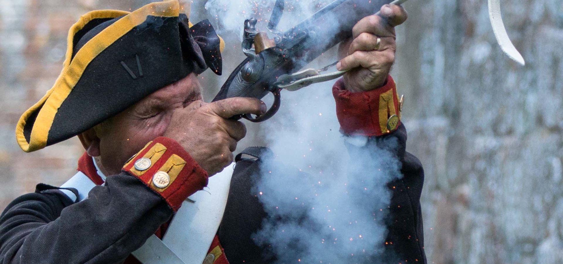 Elizabeth Castle Living History Gunner fires shot
