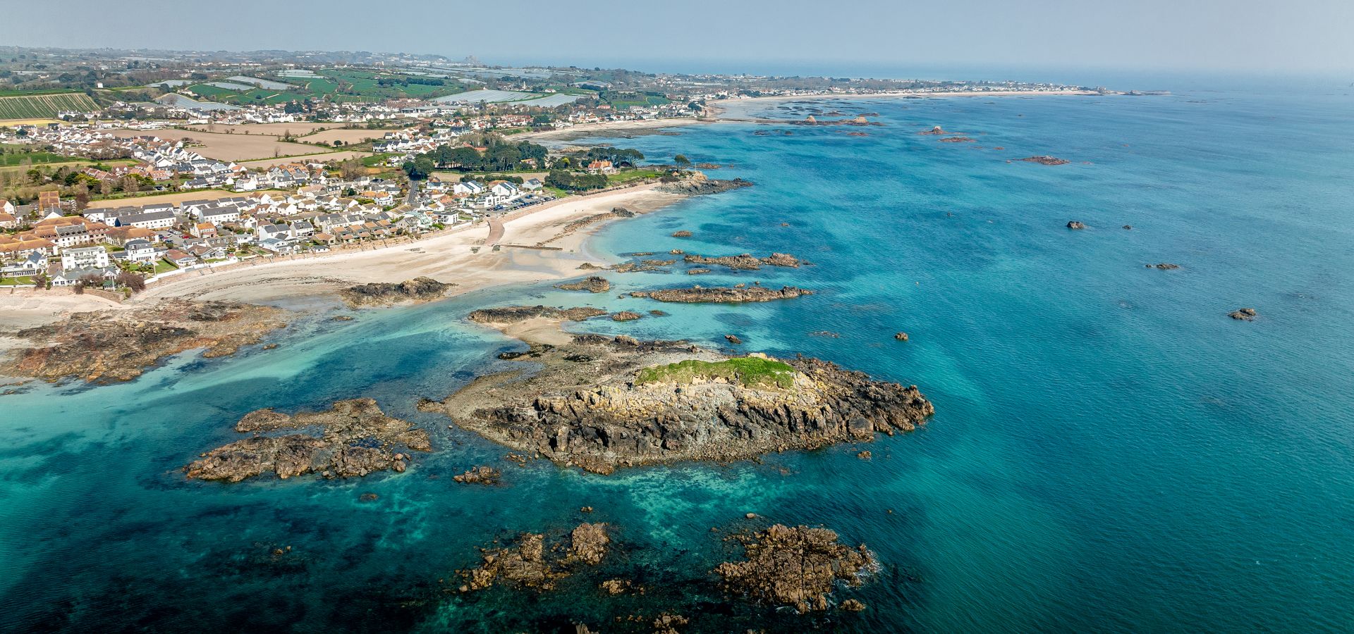 Green Island from overhead with tropical waters below
