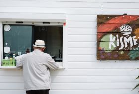 A man ordering from the window at Kismet Cabana