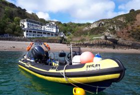 Bouley bay with the dive centre and dive boat