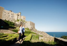 Couple with Mont Orgueil Castle in background