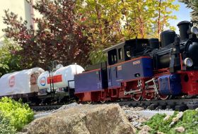 Model train in the garden crossing an embankment