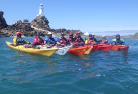 Sea kayakers at Corbiere lighthouse