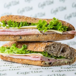 Multigrain baguette filled with ham, cheese and salad
