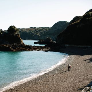 Couple walking in Bouley Bay Jersey