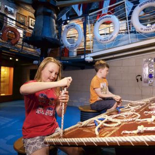 Children learn to tie knots at the Maritime Museum