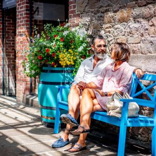 Couple relaxing on bench