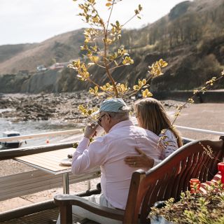 Couple enjoying coffee at Bonne Nuit Bay Cafe