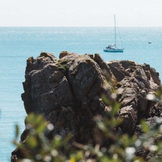 A yacht moored off Beauport Bay Jersey