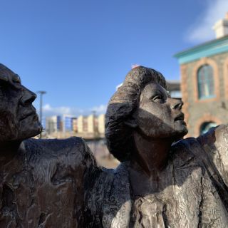 Close up of Liberation Square SCulpture - two figures, older man and a woman.