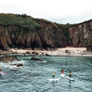 Kayakers exploring the surrounding rockpools and gullies at Gru00e8ve de Lecq