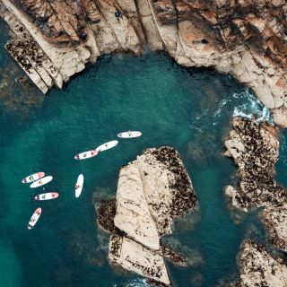 Kayakers exploring the surrounding rockpools and gullies at Gru00e8ve de Lecq