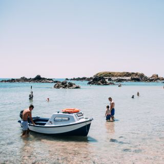 Boats and people at Green Island Beach