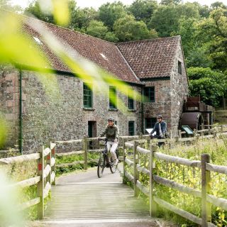 People cycling by Le Moulin