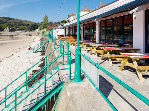 Restaurant tables beside the beach