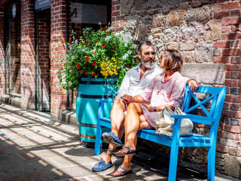 Couple relaxing on bench
