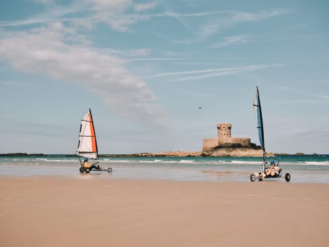 Blokarting in St. Ouen's Bay with La Rocco Tower in the background
