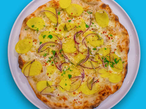 Pizza with potato and red onion