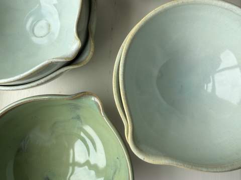 Penguin Potters pouring bowls