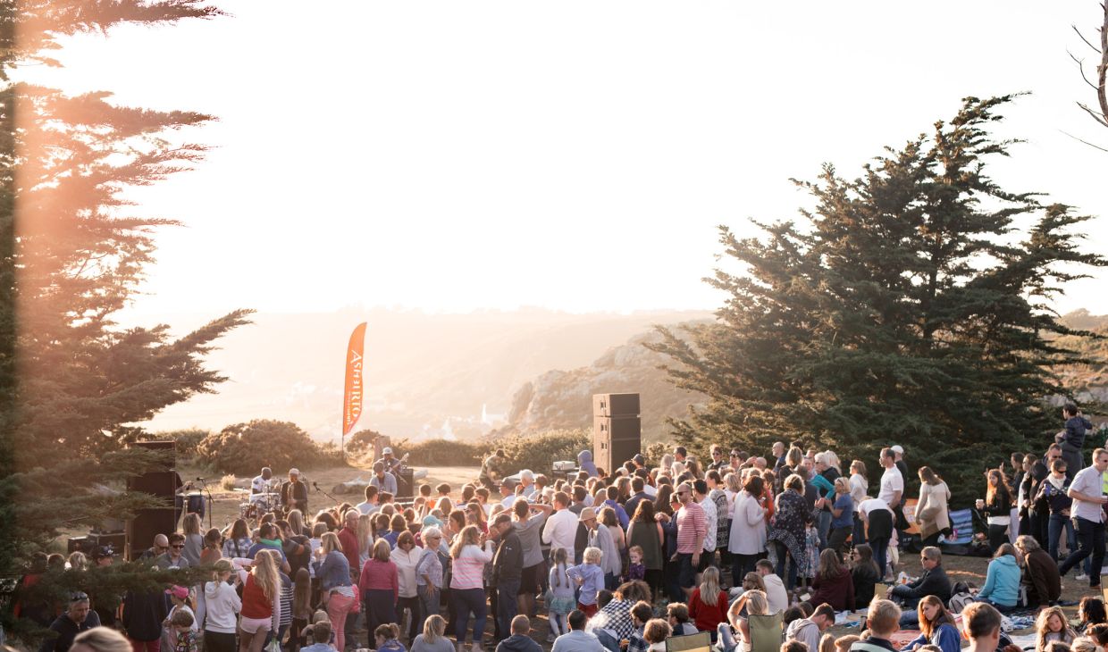 A crowd enjoying the Sunset Concert at Grantez Jersey