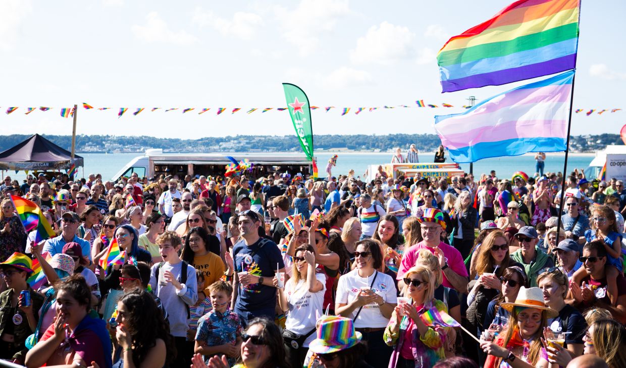 Crowd of people celebrating pride in Jersey.