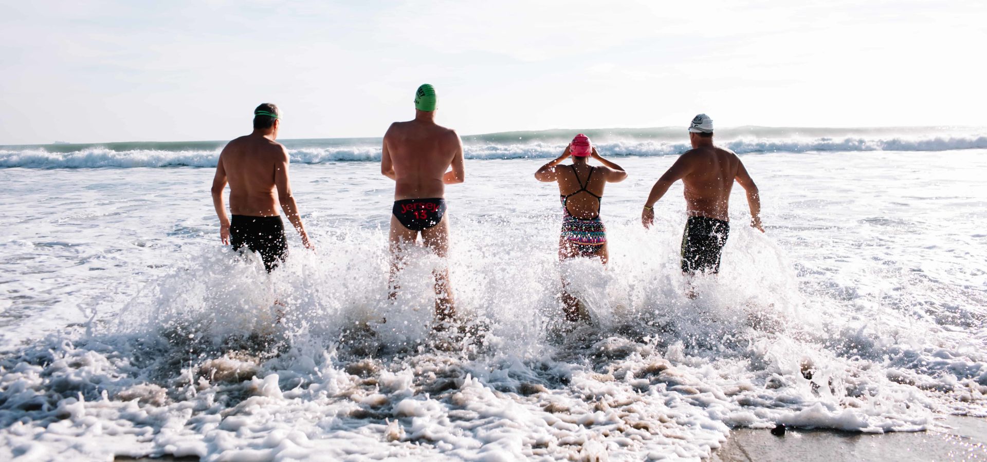 Swimmers going into the sea