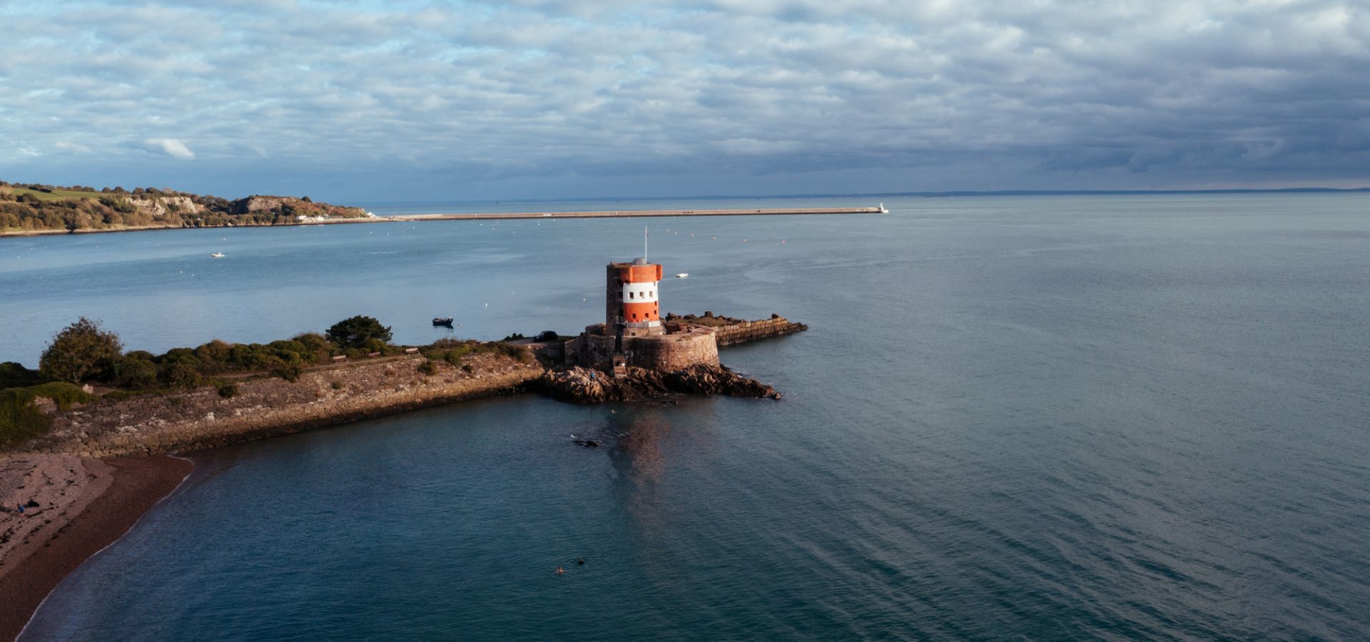 Aerial view of Archirondel round tower surrounded by flat calm sea