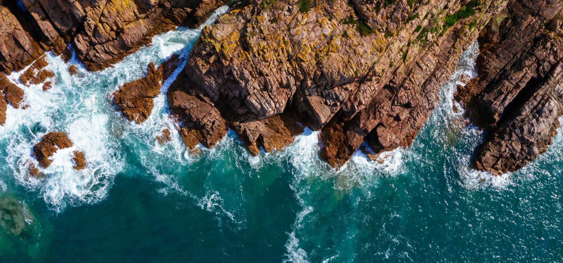 Dramatic coastline with waves crashing onto rocks