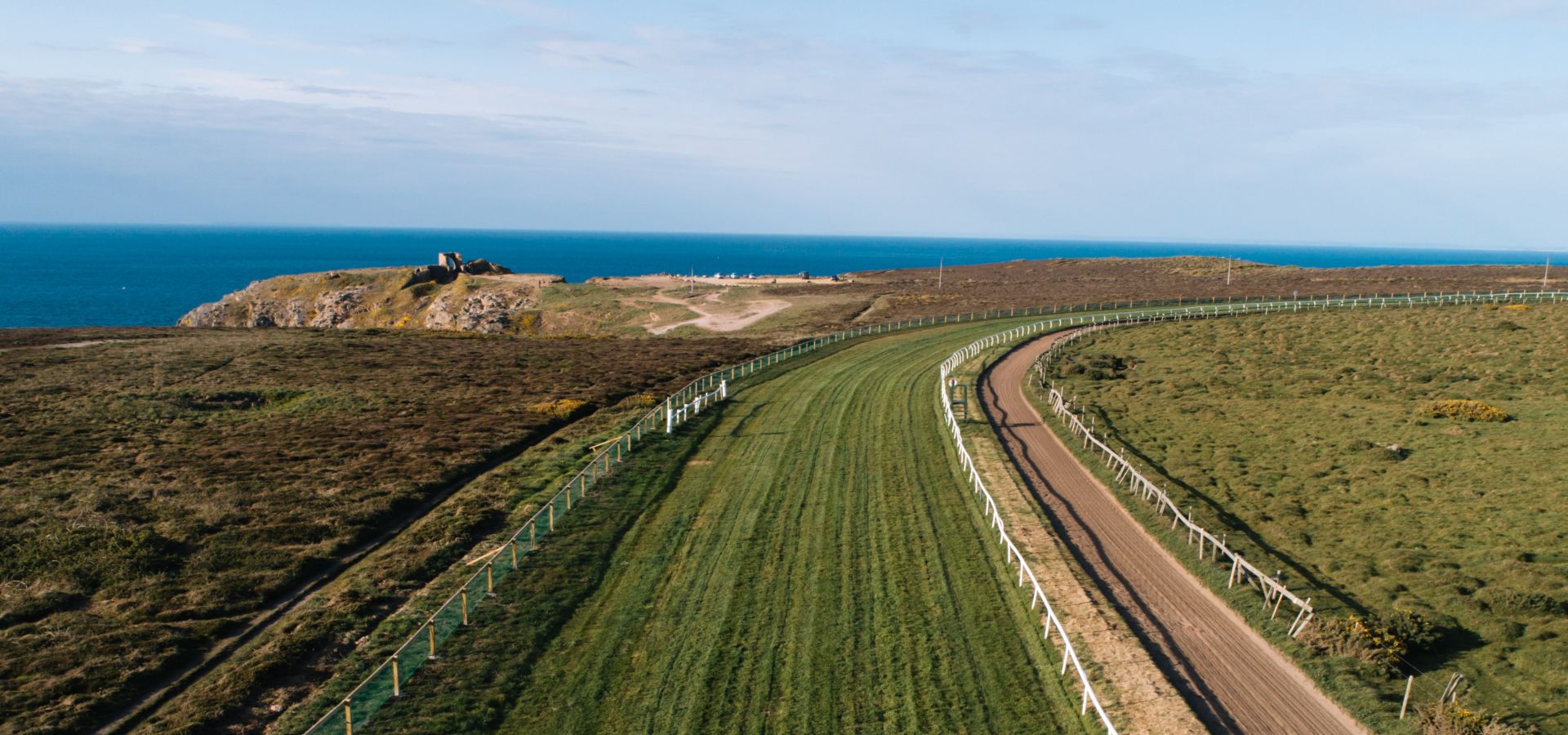 An aerial photo of Les Landes racecourse and Grosnez headland