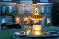 Classic car and fountain in Longueville Manor's yard