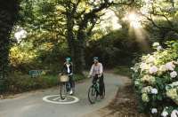 A couple cycling in Jersey's green lanes