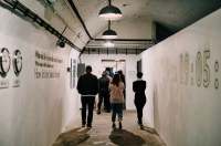 A group of people walking through the Jersey War Tunnels