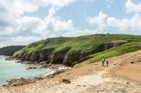Couple walking along the Jersey Tidal Trail, Plemont Jersey