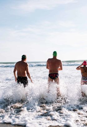 Swimmers going into the sea