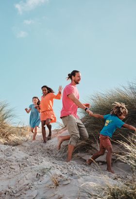 A family having fun on the sand dunes