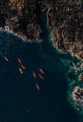 Aerial view of kayaks and cliffs