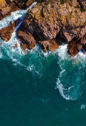 Dramatic coastline with waves crashing onto rocks