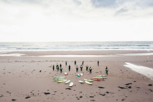 A group of surfers prepare to go in the water