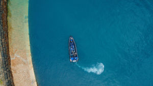 An aerial shot of a RIB boat in the water at St. Catherine
