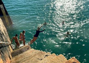 Swimmers on pier steps at Bouley Bay