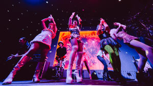 Drag queens dancing on stage