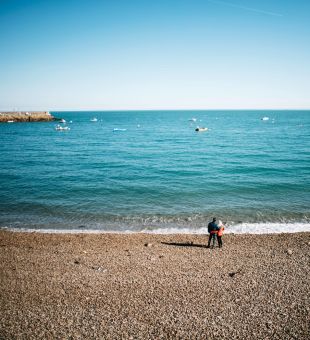 Couple standing at Bouley Bay, Jersey
