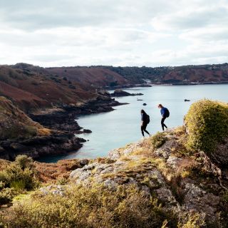Two friends walking on the cliff paths of Jersey