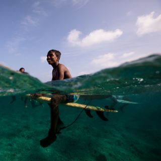 Underwater photo of young surfers