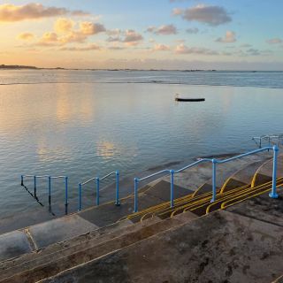 Clear, still sea water at the Lido at sunrise.