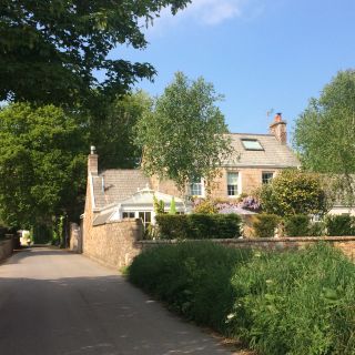 country lane with granite house